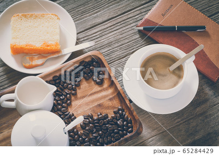 Vintage Film Look: cup of coffee with cake 65284429