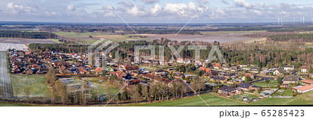 panoramic view of a small village between fields and meadows panoramic view of a small village between fields and meadows 65285423