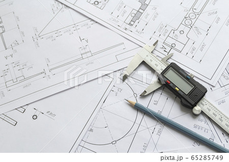 Top view of a caliper measuring tool, pencil and 65285749