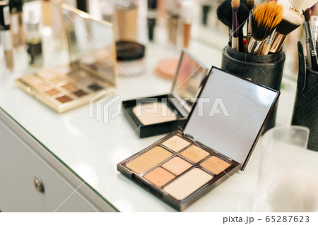 Close-up of professional powder box on woman table near mirror, no people.  65287623
