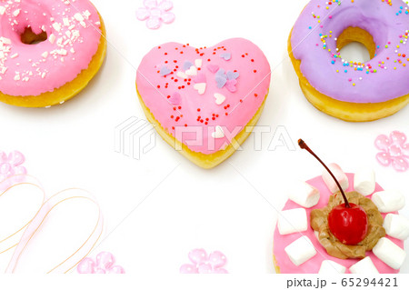 Tasty doughnut with topping isolated on white background. 65294421