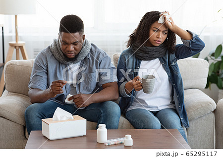Treating Coronavirus At Home. Sick Black Couple Suffering From Covid-19 Symptoms 65295117