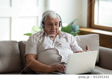 Modern senior man talk on video call on laptop 65295342