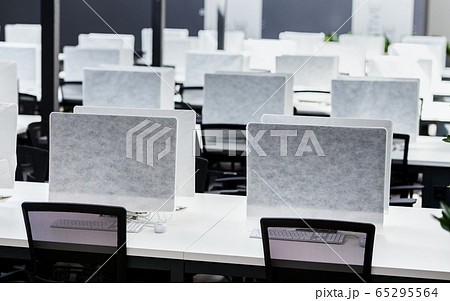 Empty places for workers in big empty rental office Empty places for workers in big empty rental office 65295564