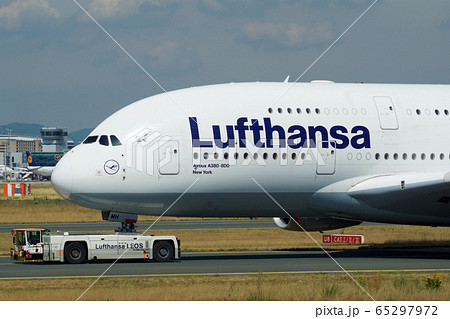 FRANKFURT, GERMANY - JUN 09th, 2017: Airbus A380 of Lufthansa with registration D-AIMH moves on taxiway by tow truck before departure from FRA airport 65297972