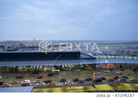 CHICAGO, ILLINOIS, UNITED STATES - MAY 11th, 2018: Several airplanes at the gate at Chicago O'Hare International Airport in the early morning with traffic jam 65298287