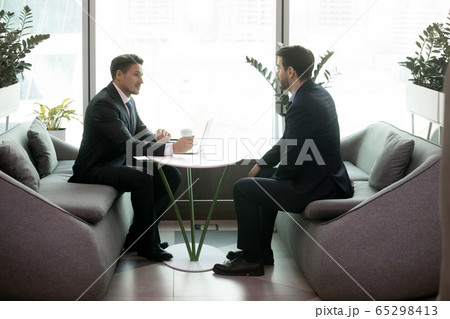 HR manager communicates with applicant during job interview in office HR manager communicates with applicant during job interview in office 65298413