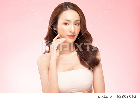 Beautiful Asian woman smile with clean and fresh skin Happiness and cheerful with positive emotional,isolated on pink background,Beauty Cosmetics and spa Treatment Concept 65303062