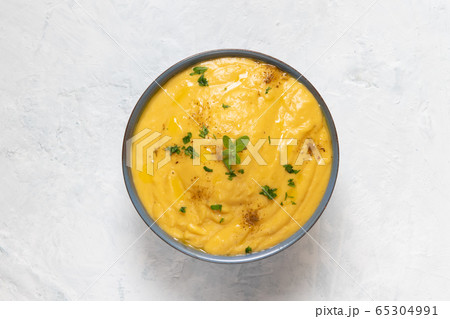 Vegeratian red lentil creamy soup in bowl Vegeratian red lentil creamy soup in bowl 65304991