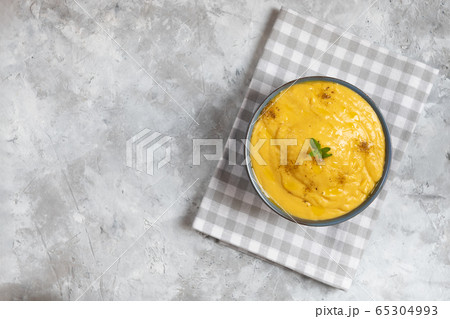 Vegeratian red lentil creamy soup in a bowl  65304993