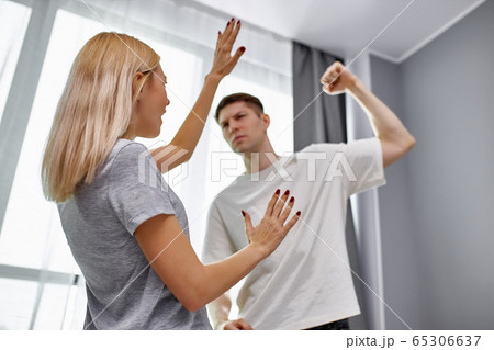 domestic violence, man raises his hand to wife 65306637