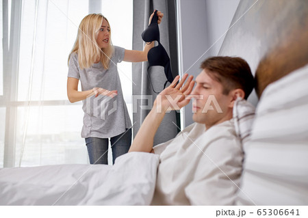 what it is woman with strange bra in hands, man cheated on his wife 65306641
