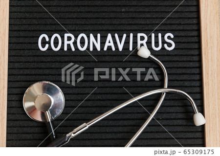 Text phrase Coronavirus and stethoscope on black 65309175