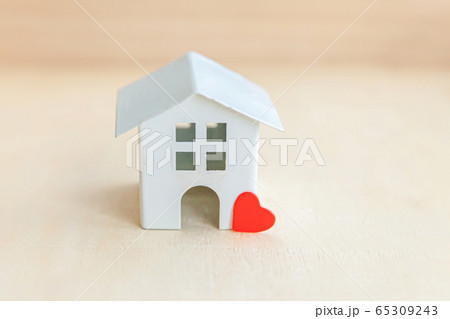 Miniature toy model house with red heart on wooden Miniature toy model house with red heart on wooden 65309243
