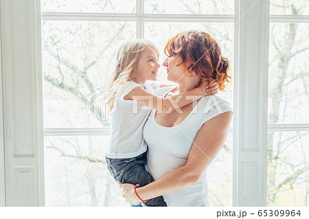 Stay Home Stay Safe. Young mother holding her 65309964