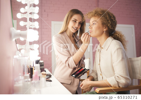 Professional Make up Artist Working with Client 65310271