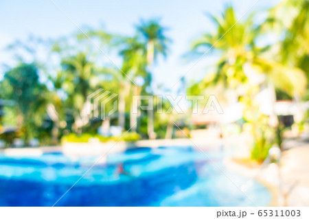Abstract blur outdoor swimming pool in hotel resort Abstract blur outdoor swimming pool in hotel resort 65311003