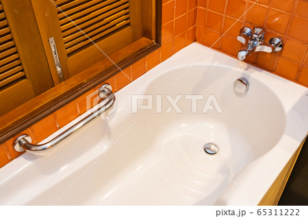 Empty white bathtub decoration interior of toilet Empty white bathtub decoration interior of toilet 65311222