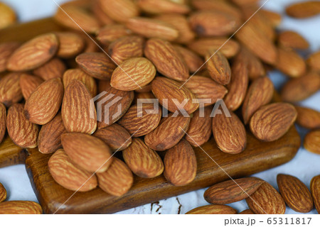 Roasted almond for snack - Almonds nuts on wooden 65311817