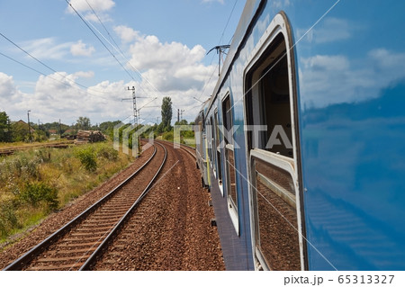 Railroad travel leaning out the window 65313327