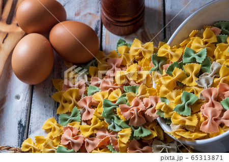 dry pasta on rustic wood and fresh eggs dry pasta on rustic wood and fresh eggs 65313871