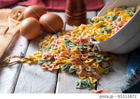 dry pasta on rustic wood and fresh eggs dry pasta on rustic wood and fresh eggs 65313872