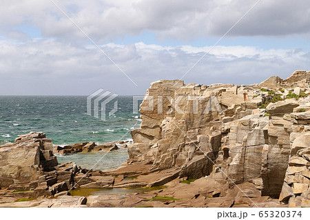 Cliffs on the coast of the Ile Grande in Brittany 65320374