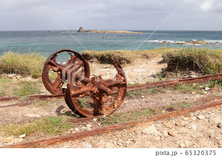 Remains after of granite mining on Ile Grande in Brittany 65320375