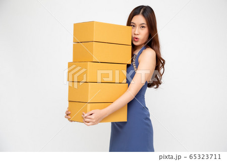Happy Asian woman holding package parcel box, 65323711