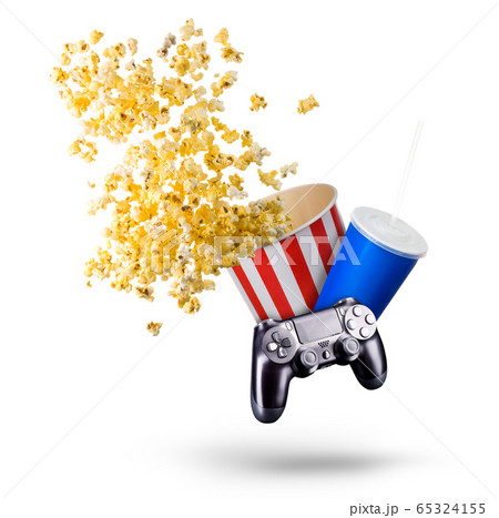 Paper bucket with popcorn, cup of drink and video game joystick on white Paper bucket with popcorn, cup of drink and video game joystick on white 65324155