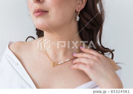 Close-up of woman wearing a Jewelry, bijouterie and accessories. 65324561