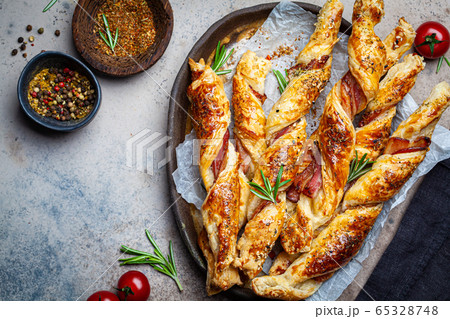 Crispy bread sticks with cheese, bacon and spices. Crispy bread sticks with cheese, bacon and spices. 65328748