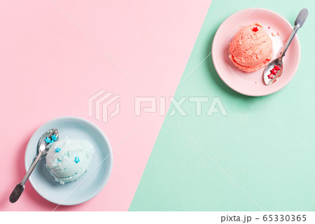 Two plates with fresh natural homemade fruits ice-cream or gelato on a duotone background. 65330365