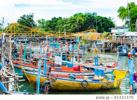 The fishing boat moored in the river access to the sea. 65331370