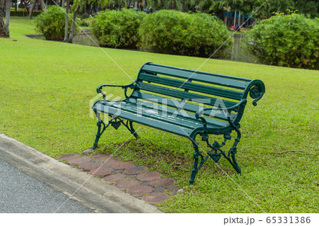 Chairs on the lawn in the park. 65331386