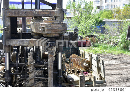 Construction machine for drilling holes in the 65333864