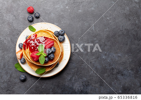 Delicious homemade pancakes with summer berries 65336816