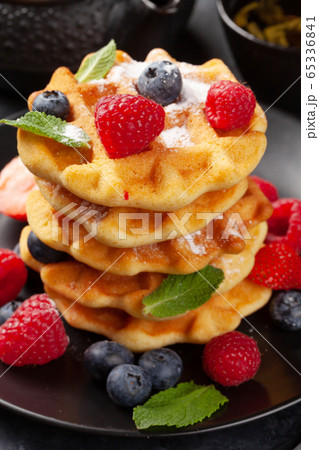Delicious belgian waffles with summer berries 65336841