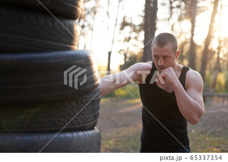Man fighter training boxing outdoor fitness 65337354