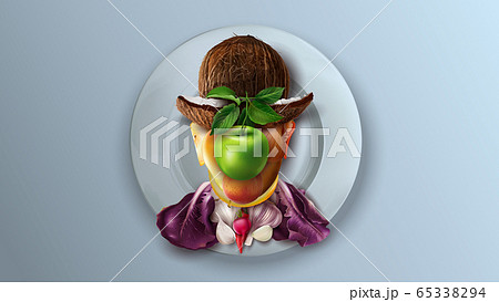 Fruit and vegetable collage on a plate repeats the male portrait by Magritte. Fruit and vegetable collage on a plate repeats the male portrait by Magritte. 65338294