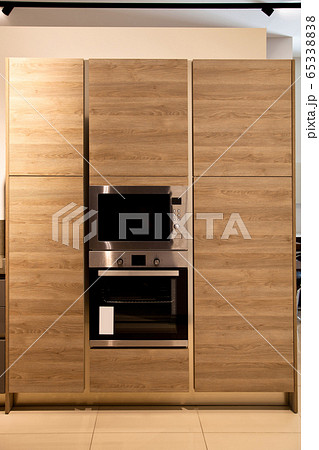 Interior of luxurious wooden modern kitchen oak Interior of luxurious wooden modern kitchen oak 65338838