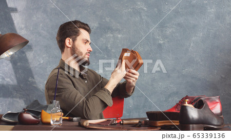 young attractive male designer working in his Studio young attractive male designer working in his Studio 65339136
