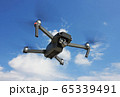 Flying Drone in a sky 65339491