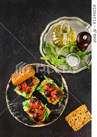 Vertical shot of a plate with delicious vegan avocado sandwiches 65340058