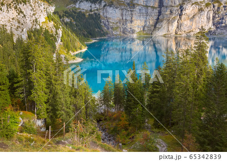 Panorama of Oeschinensee lake and Alps, Switzerland. 65342839