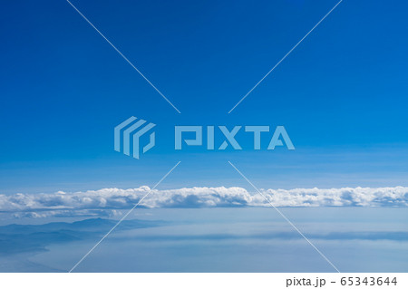 Clouds, Mountain range and coastline with blue sky background Clouds, Mountain range and coastline with blue sky background 65343644