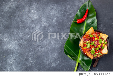 Mexican black bean soup with homemade fried tortillas totopos nachos served with guacamole 65344127