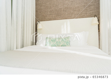 White comfortable pillow on bed decoration interior White comfortable pillow on bed decoration interior 65346873
