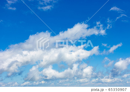 white fluffy clouds on the blue sky. beautiful white fluffy clouds on the blue sky. beautiful 65350907