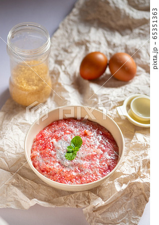 A bowl of sweet red sago in coconut cream.Asian A bowl of sweet red sago in coconut cream.Asian 65351363